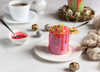 Carrot cake or traditional Orthodox Easter sweet bread with carrot covered pink glaze. Carrot Kulich  decorated with pink glaze.