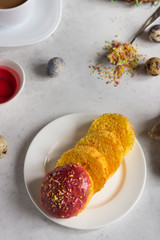 Carrot cake or traditional Orthodox Easter sweet bread with carrot covered pink glaze. Carrot Kulich  decorated with pink glaze.