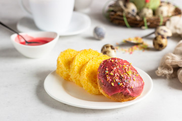 Carrot cake or traditional Orthodox Easter sweet bread with carrot covered pink glaze. Carrot Kulich  decorated with pink glaze.