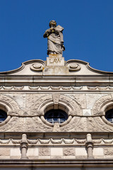 Fototapeta premium Law Statue on Cornice of building