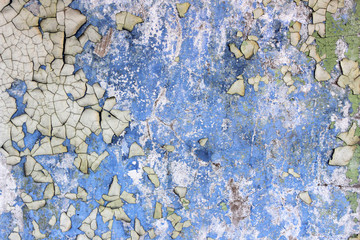 Old cracked paint on blue wall texture
