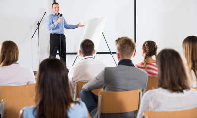 Male coach giving presentation