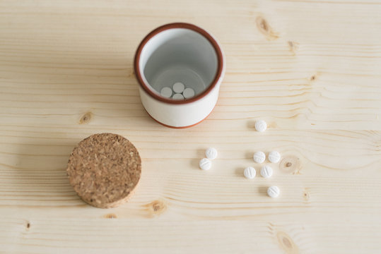 Pills in Ceramic Container