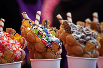 Fresh sweet bakery with candies and ice cream, street food