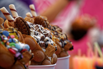 Fresh sweet bakery with candies and ice cream, street food