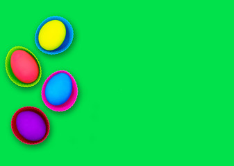Easter eggs isolated on green background