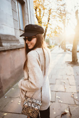 Street portrait of young beautiful fashionable woman