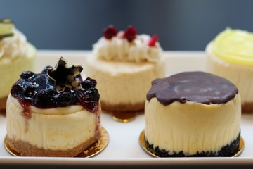 Close-up on cheesecakes on a gold plate on a platter