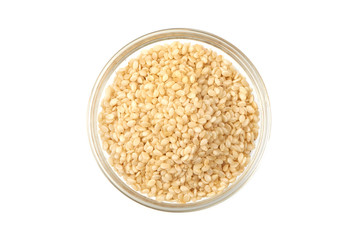 Sesame seeds in bowl, close-up, isolated on white background. Top view