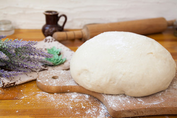  yeast dough sprinkled with flour on the table