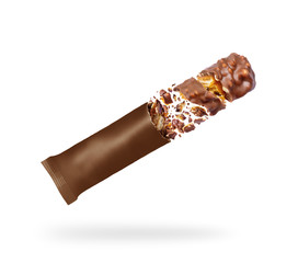 Chocolate bar with nuts falls from the packaging, isolated on a white background