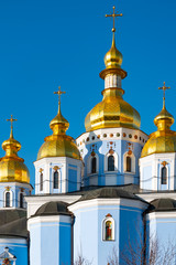 Fototapeta na wymiar St. Michael's Golden Domed Monastery, classic shinny, golden cupolas of the cathedral cupolas of the cathedral, Ukraine, Kiev