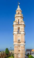Fototapeta premium Baroque Tower of Victory in Estepa, province of Seville. Charming white village in Andalusia. Southern Spain. Picturesque travel destination on Spain.