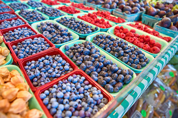 Fresh boxes of assorted berries on display at the farmers market