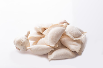 heap of frozen dumplings on a white background. Isolated Dumplings