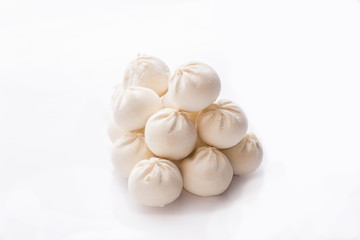 Obraz na płótnie Canvas heap of frozen dumplings on a white background. Isolated Dumplings