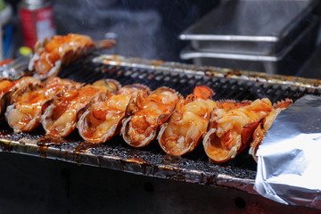 Lobster in the open shell. Asian fast food, food cooked on open