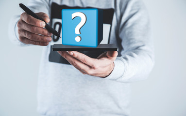 man hand tablet with question mark