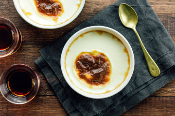 Turkish rice pudding on a wooden table, top view
