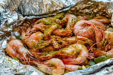 Fresh baked king shrimps with the oriental herbs