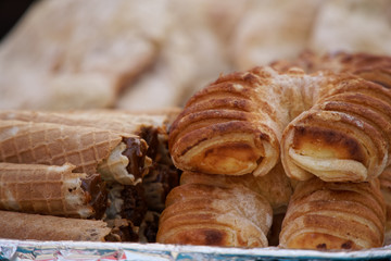 Fresh Croissant bread, sweet bakery street food.