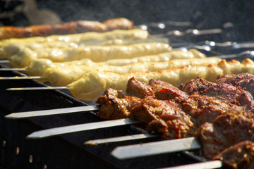 Barbecue meat on grill, traditional street food