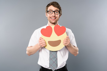 excited businessman holding smiling face with heart-eyes in hands