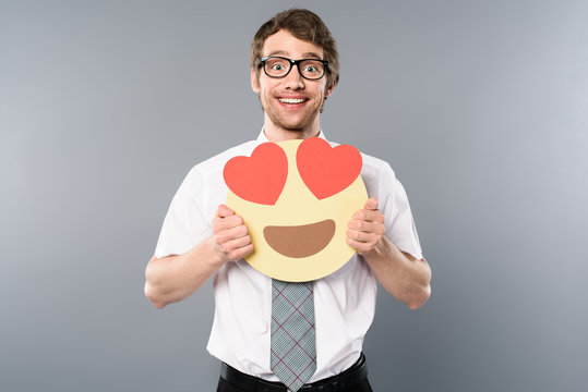 excited businessman holding smiling face with heart-eyes in hands