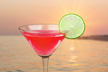 Glass of alcohol  cocktail on background