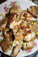 fried fish in a plate on the table