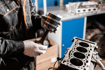 Close-up of the disassembled engine on the stand. New cylinders. Motor capital repair. Sixteen valves and four cylinder. Car service concept.