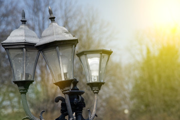 Wrought lantern against the sky, old street light.