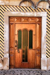 Old and colorful wooden door with iron details