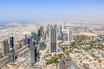 Fototapeta na wymiar Aerial view of Dubai Skyline, Amazing Rooftop view of Dubai Sheikh Zayed Road Residential and Business Skyscrapers in Downtown Dubai, United Arab Emirates