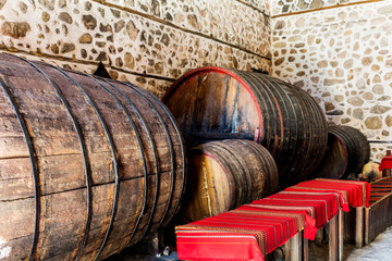 Traditional Wine Cellar with Huge Wine Barrels in the Historic City of Melnik, Bulgaria. 
