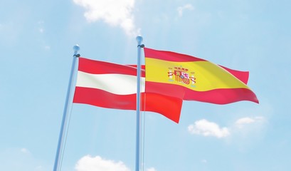 Austria and Spain, two flags waving against blue sky. 3d image