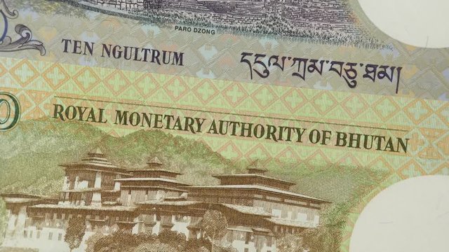 Bhutan ngultrum notes rotating. Bhutanese currency, money, economy. 4K stock video footage