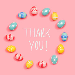 Fototapeta na wymiar Thank you message with round frame of Easter eggs