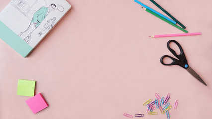 Office workstation on a wooden table. Cup of coffee, pencils, glasses, stickers, clips, calculator , scissors, brushes, acrylic paints, flash drive