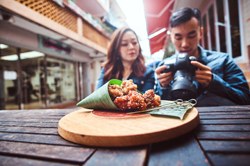 Young asian couple enjoy chinese food at cafe