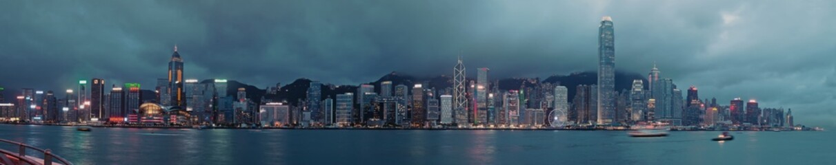 Obraz premium Panorama of Hong Kong City skyline at night at taipan at typhoon . View from across Victoria Harbor HongKong