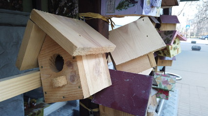 Wooden birdhouses on the street. Social real estate.