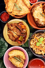 Assorted Chinese food set. Chinese noodles, fried rice, peking duck, dim sum, spring rolls. Famous Chinese cuisine dishes on table. Chinese restaurant