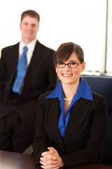 Happy Businesswoman and Businessman in Office - Business Concept