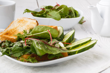 Diet healthy food. Bread with avacado, tomatoes and basil