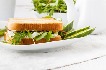 Sandwich with fresh lettuce,basil and cream cheese