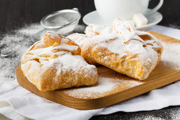 Pies of puff pastry close up