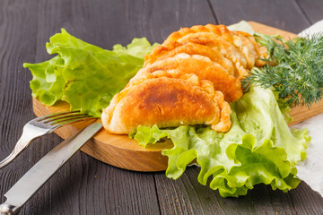 Fried pie with meat and sauces. Hot homemade empanada. Delicious snack