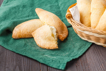 Homemade baking, cookies and decorations, juicer with curd on white wooden table