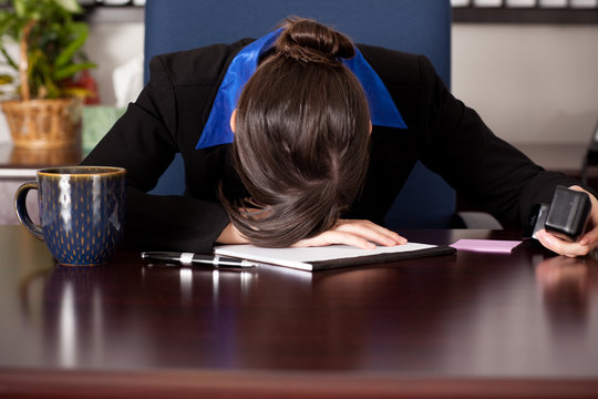 Businesswoman Sleeping at Her Desk - Business Exhaustion